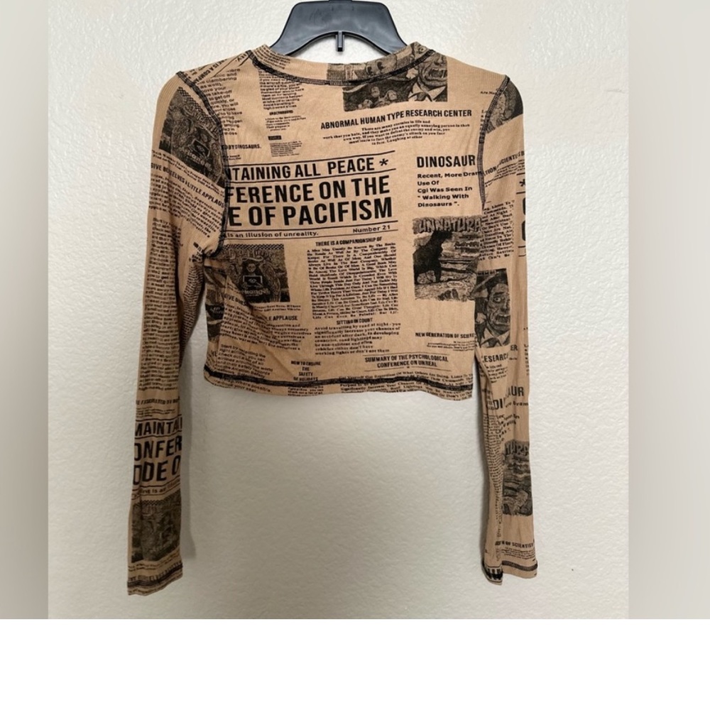Dressed in LaLa Ribbed Cropped Long Sleeve News Paper Top